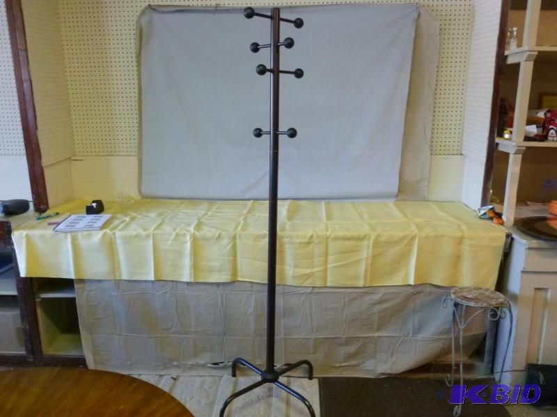 lot 214 image: Metal coat tree that measures 70.5" H....