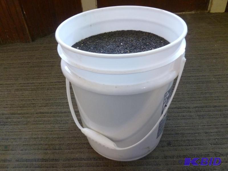 lot 218 image: Large five gallon pail of bird thistle seed, ...