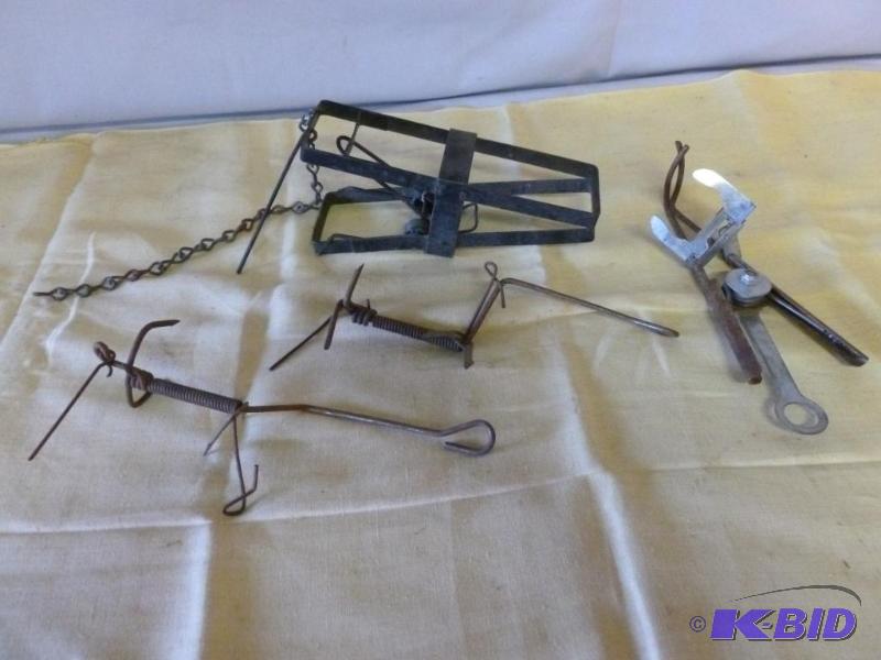 lot 228 image: Lot of four traps....