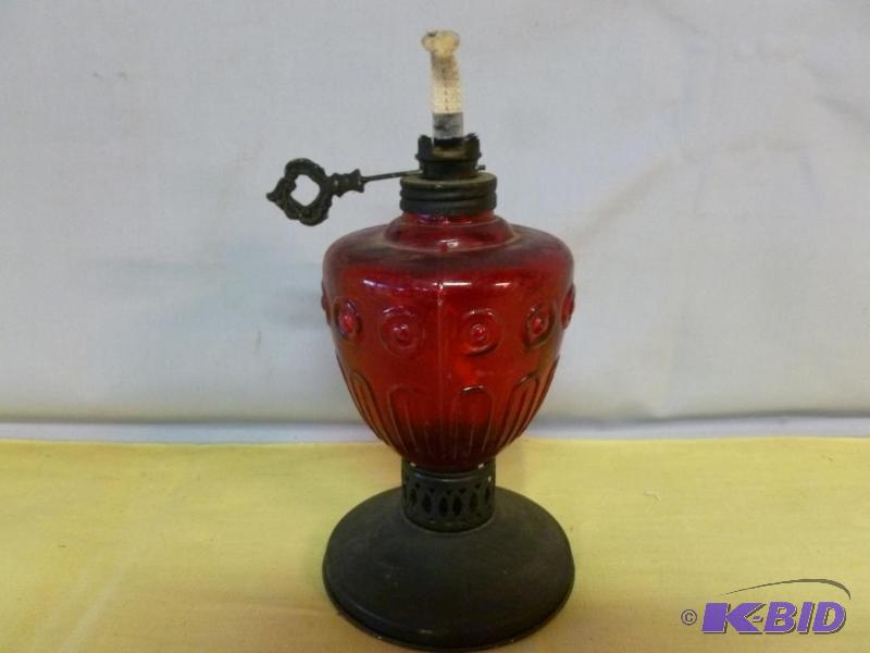 lot 28 image: Vintage metal bodied and ruby red glass oil l...