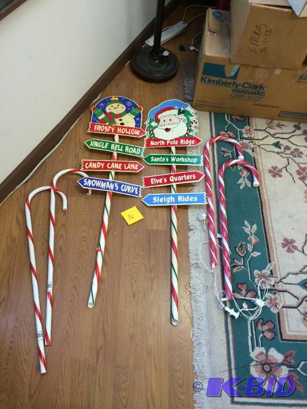 Yard decorations, 2 lit candles-of which 1 li...