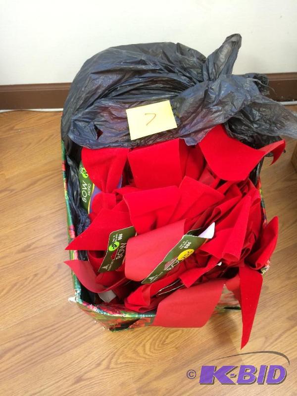 A whole box plump full of red bows...