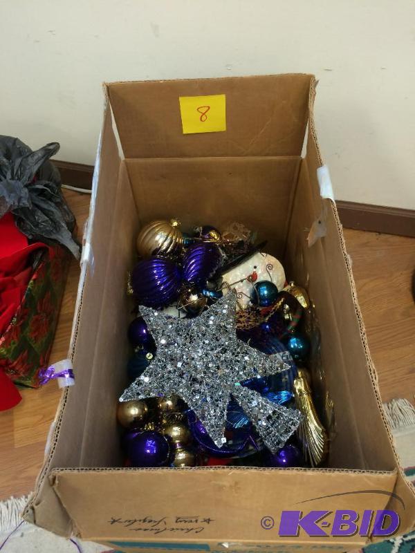 Box of ornaments and a tree topper...