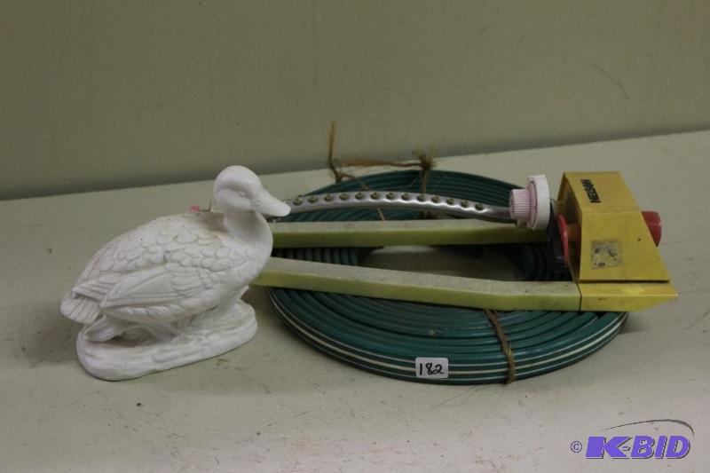 lot 182 image: Hose, Lawn Sprinkler and a Duck...