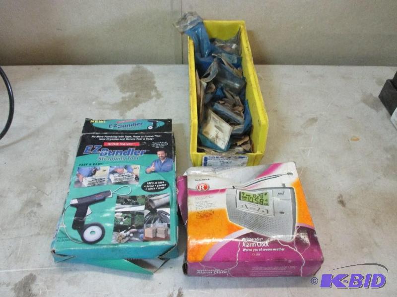 lot 17 image: EZ bundler, weather radio, door stops, all ne...