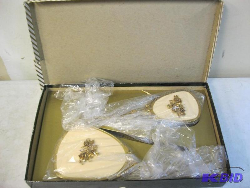 lot 33 image: Three Piece Decorative Metal Brush Comb And M...