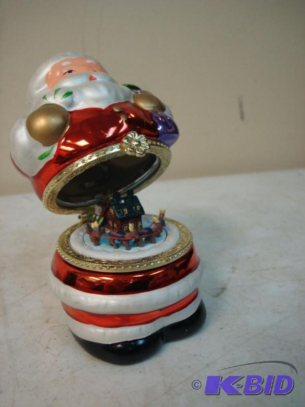 lot 76 image: Small Santa With A Moving Deer Inside Figurin...