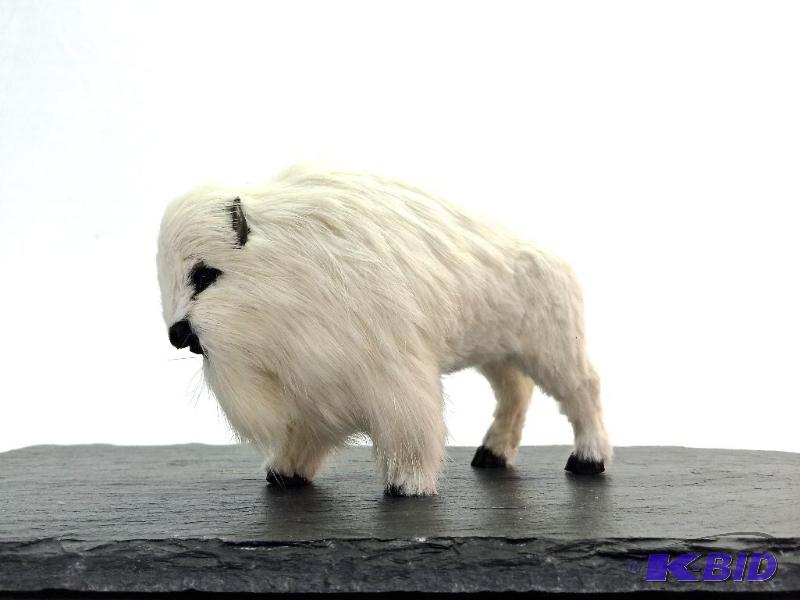 lot 6 image: White baby buffalo sculpture