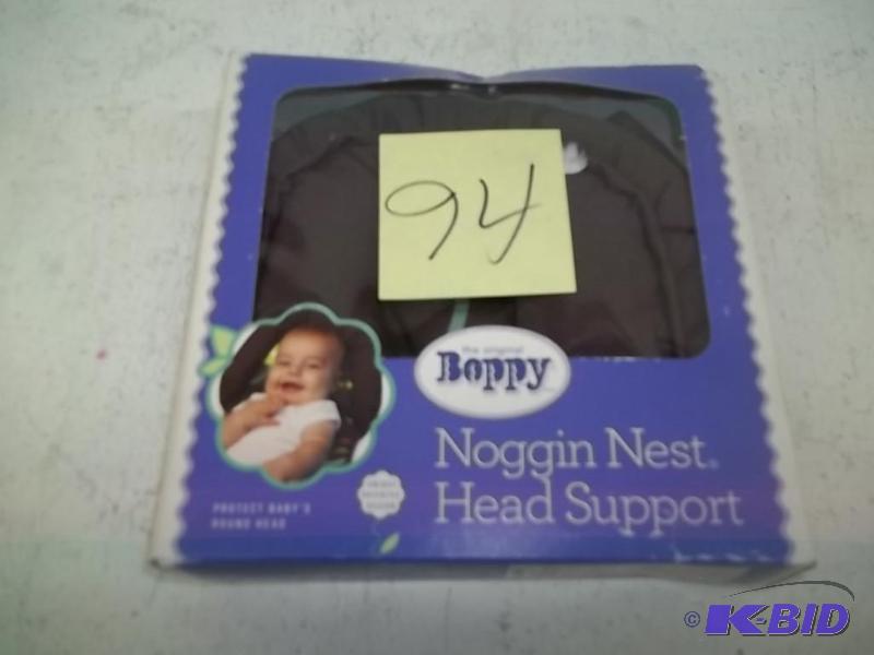 lot 94 image: Boppy Noggin Nest Head Support, Brown Wheels