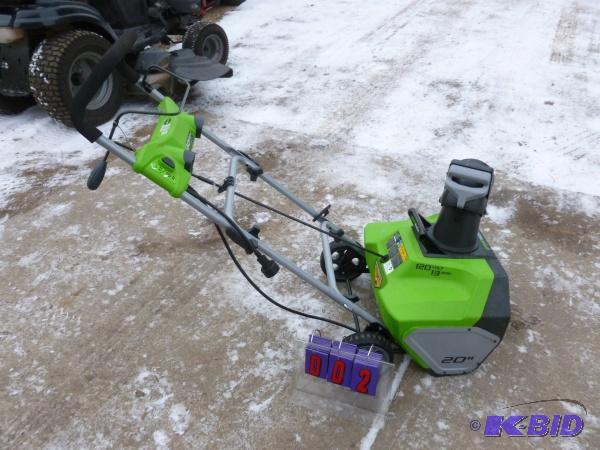 Greenworks 110 volt snow thrower. Appears to ...