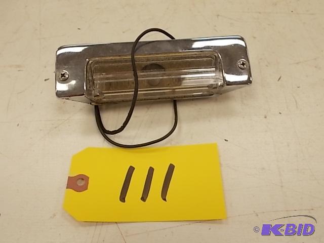 lot 111 image: 1957 Chev. Gold License Plate Bracket...