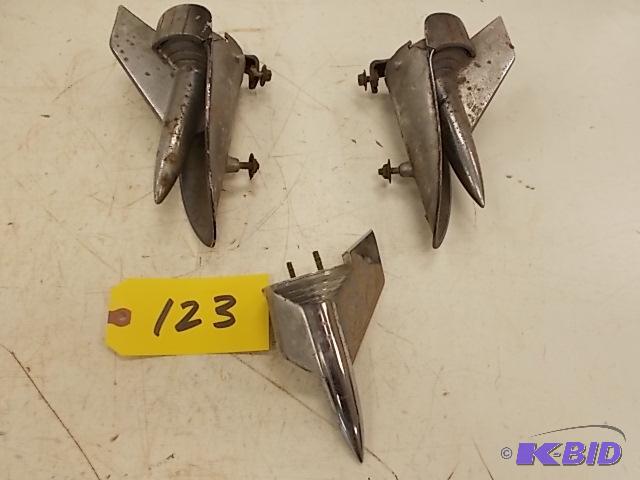 lot 123 image: (3) 1957 Chev. Hood Emblems...