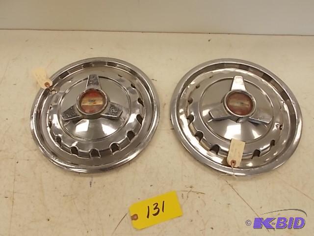 lot 131 image: (2) 1957 Chev. Belair Spinner Hub Caps...