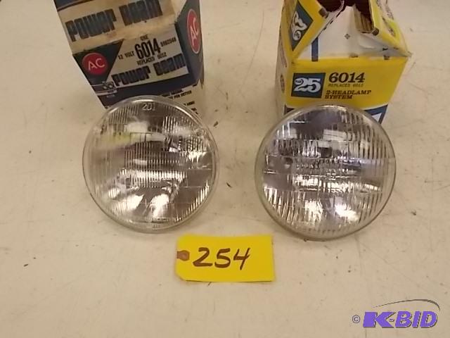 lot 254 image: (2) 6014 Head Lights, NOS...