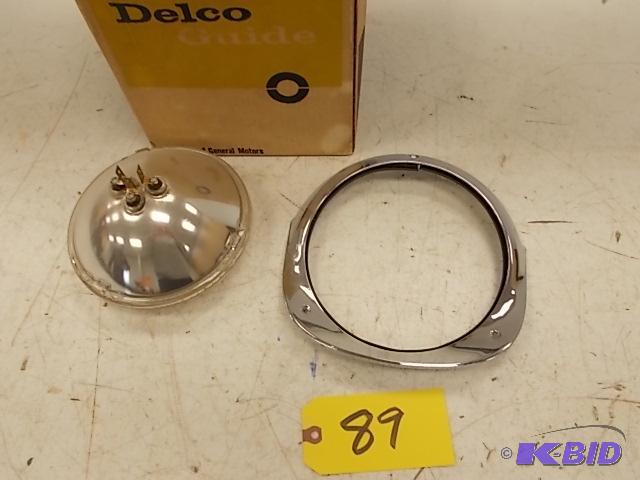 lot 89 image: 1956 Chev. Head Light Bezel, NOS, with New 60...