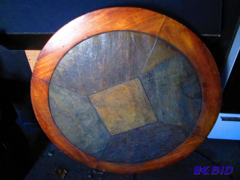 Round slate top table, with wood edge. Very n...