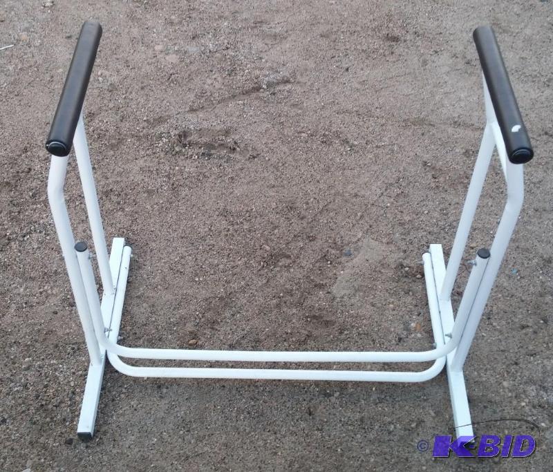 Toilet seat railing. Slips over toilet and gi...