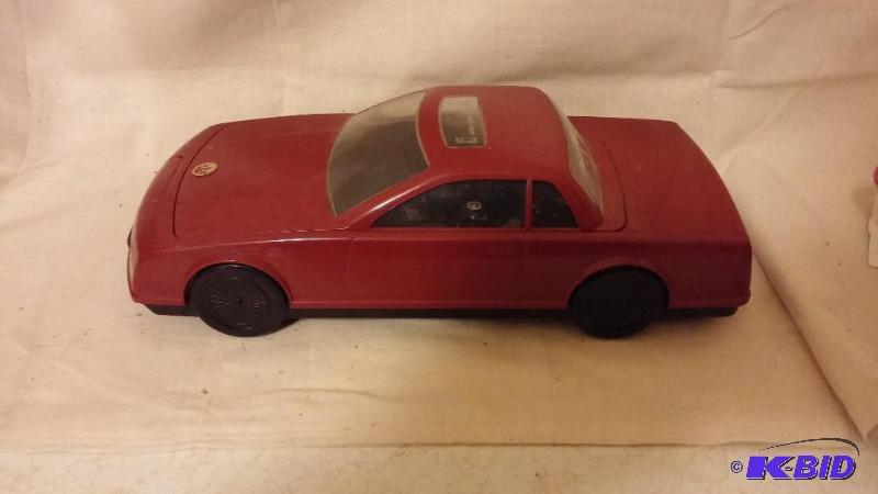 lot 13 image: Vintage Red Car VHS Rewinder...