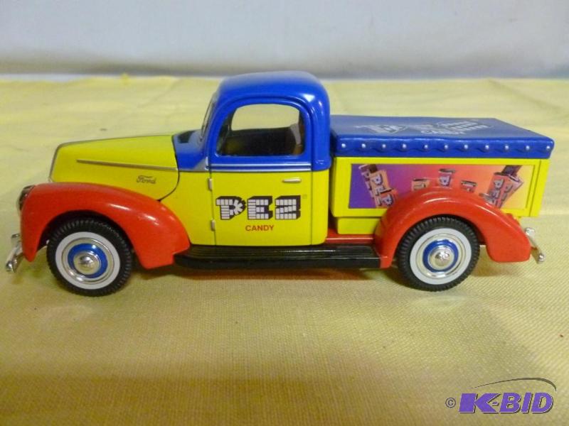 lot 216 image: Golden Wheel 1940 Ford Pez 124 scale die cas...