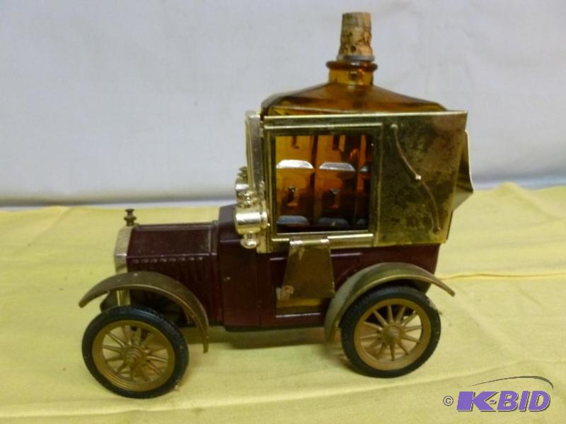 lot 239 image: Nice old time metal car themed whiskey server...