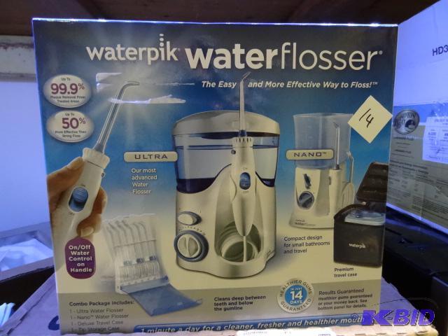 lot 14 image: Water pik water flosser. Brand new with facto...