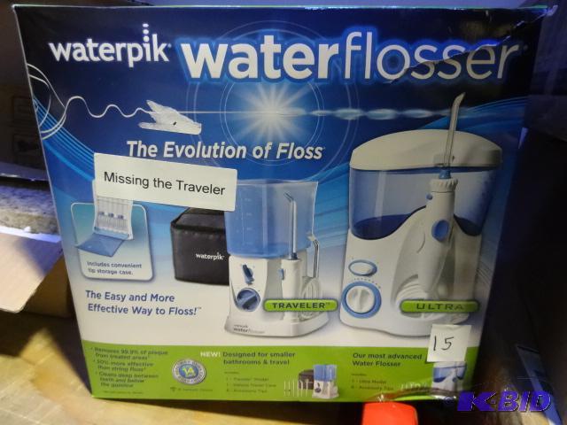 lot 15 image: Water pik water flosser. Includes the ultra u...