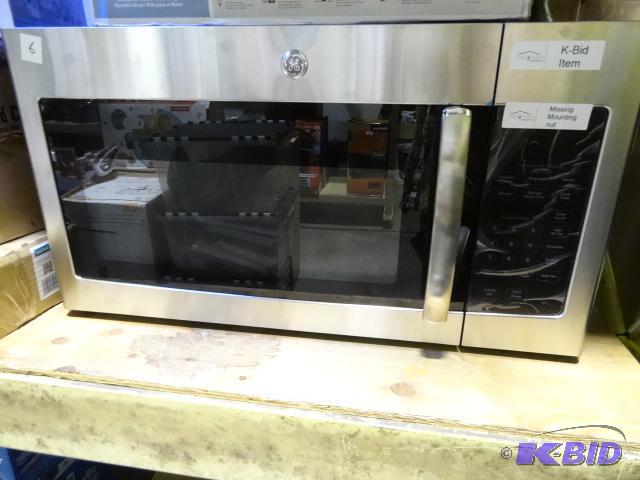 lot 6 image: GE over the range microwave. Model JVM3160RF2...