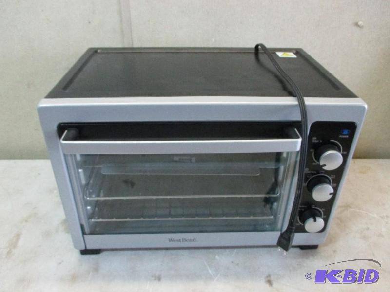 lot 24 image: West bend toaster oven...