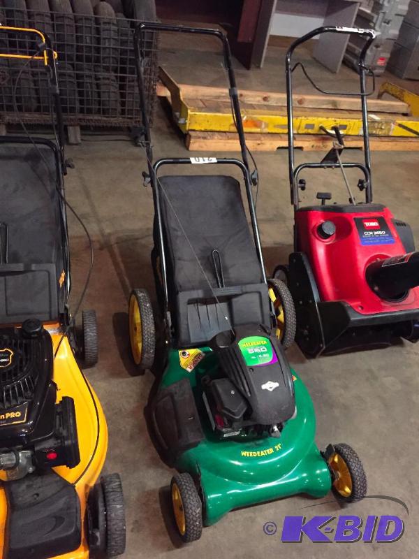 lot 210 image: Weed Eater lawn mower. Looks new. Motor has c...