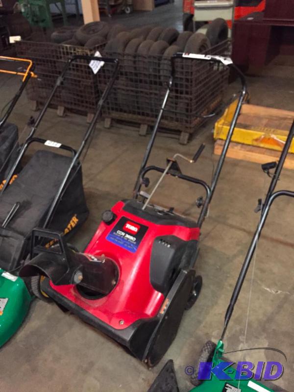 lot 211 image: Toro snow blower. Motor has compression....