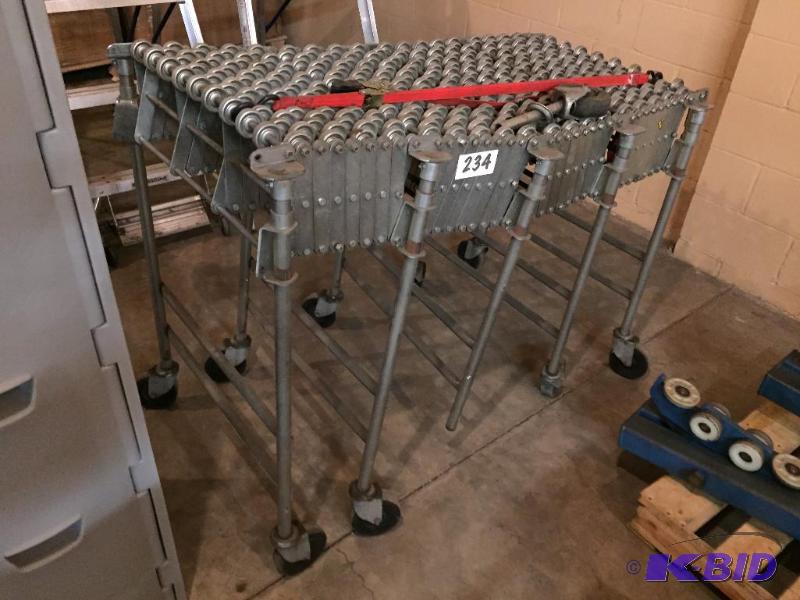 lot 234 image: Metal skate wheel flexible conveyor section....