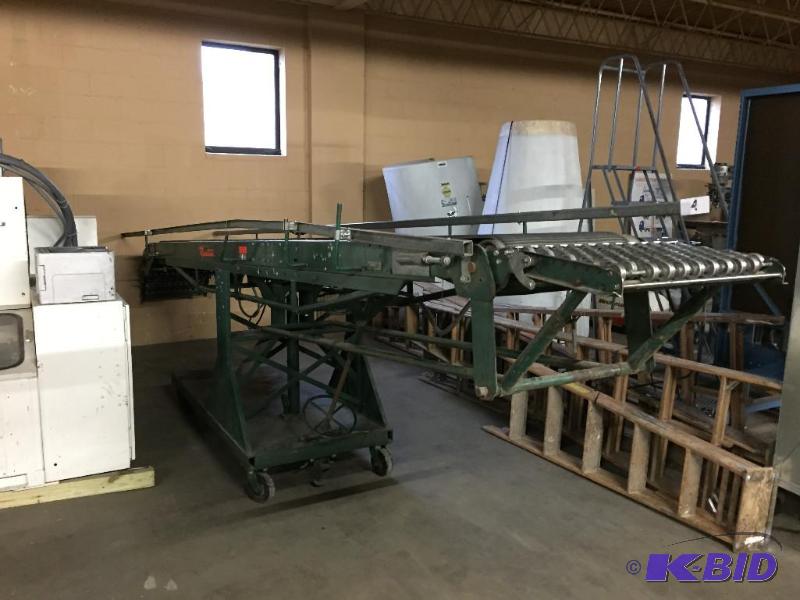 lot 4 image: Rapistan powered belt conveyor. Has lift and ...