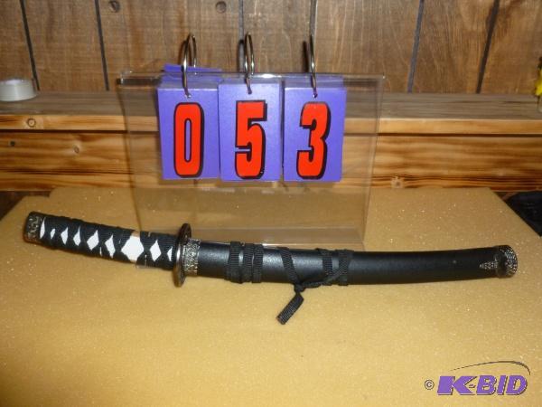 lot 53 image: Japanese short sword. 19 overall. Has 11 bl...