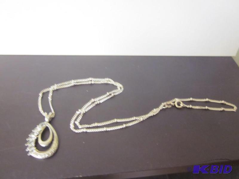 lot 10 image: Tear dropped shaped pendant with chain, marke...