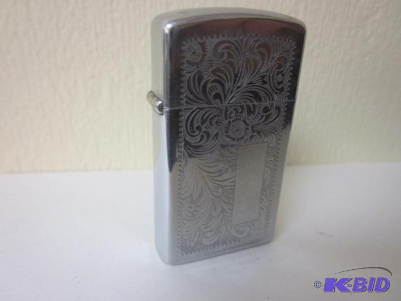 lot 20 image: Vintage with   Zippo lighter with f...