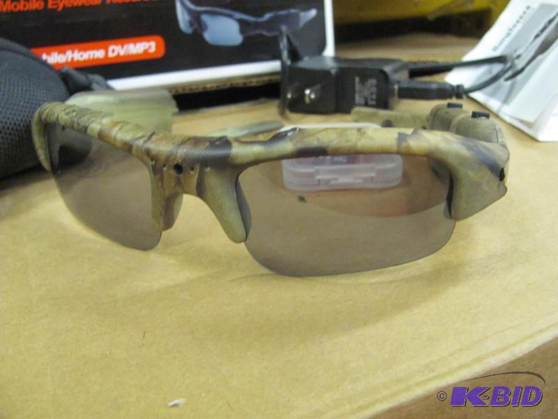 lot 38 image: Check out these cool sunglasses with built-in...
