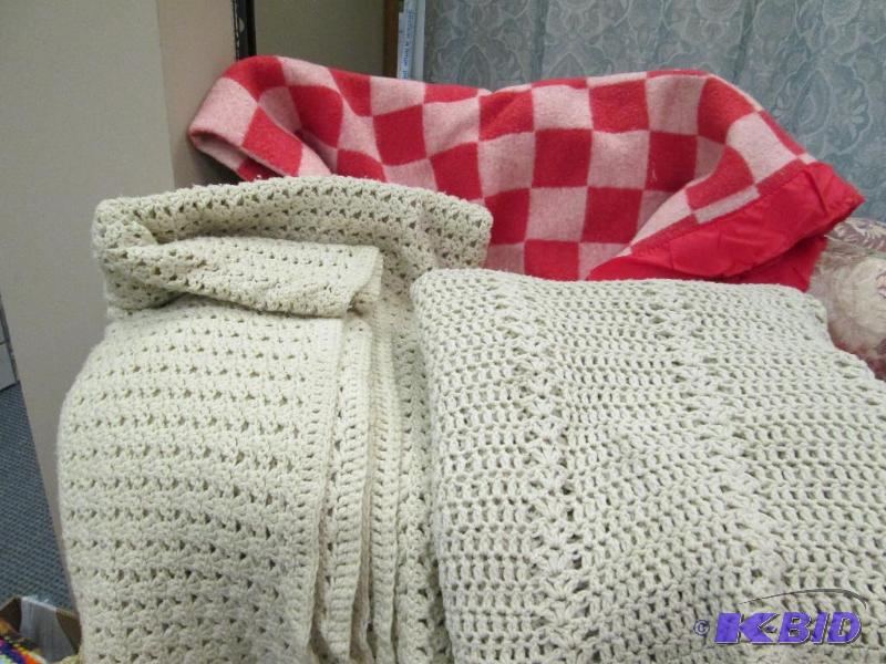 Red check blanket and two afghans...