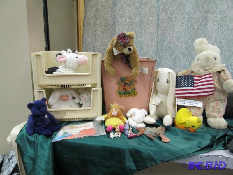 Assortment of stuff animals, old time trash c...
