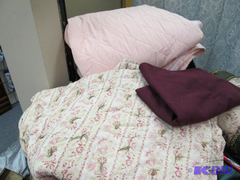 One heavy quilt, bed cover, and small blanket...