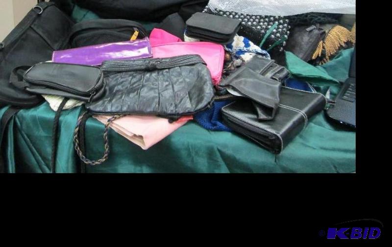 Assortment of different kind of purses and ba...