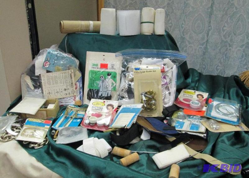 Assortment of sewing tools like buckles, elas...