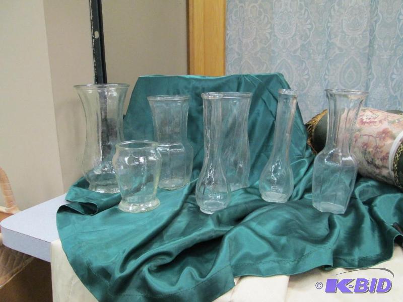 Qty 7 different size glass vases...