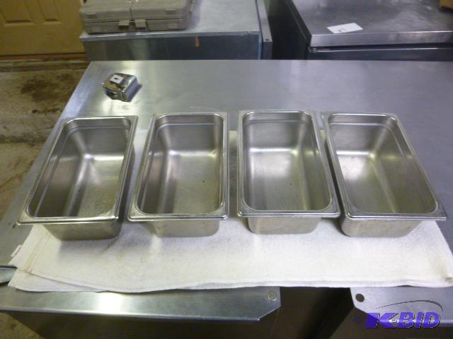 lot 21 image: Four Stainless Steel Pans Third size....