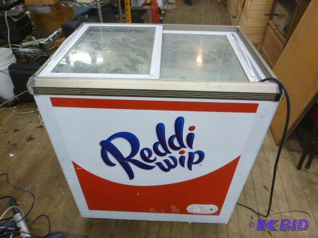 lot 30 image: Free Standing Freezer Model SC-142 - On caste...