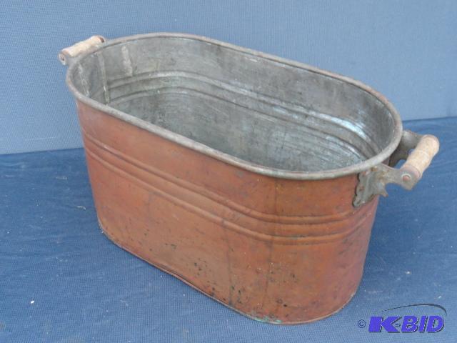lot 106 image: Copper boiler with wood handles, good shape...