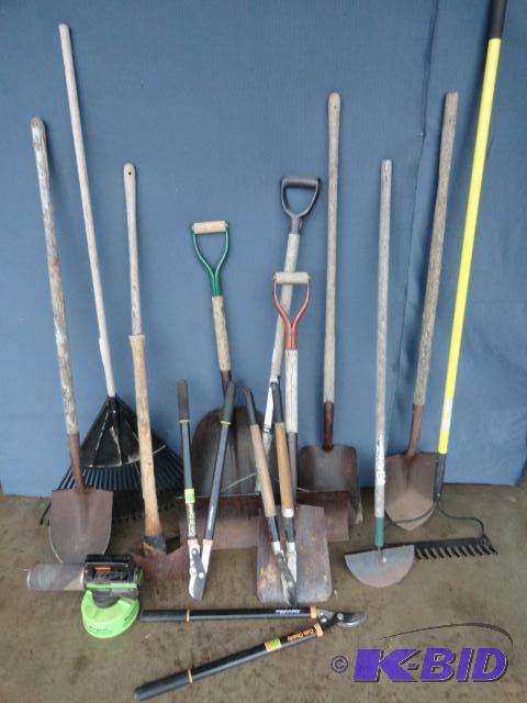 lot 129 image: Assortment of hand tools shovels, rakes, Fis...