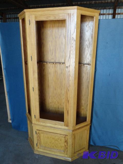 lot 233 image: Custom Golden Oak gun cabinet with lower stor...