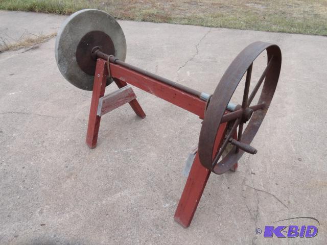 lot 26 image: Grinding wheel with barn wood stand...