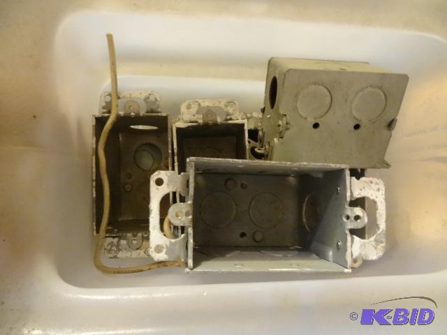 lot 214 image: Pole Barn Spikes. Metal Outlet Boxes...