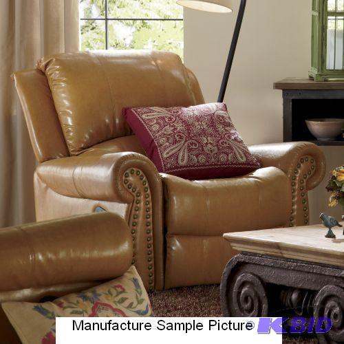 lot 18 image: Camel Nailhead Recliner - This comfy recliner...